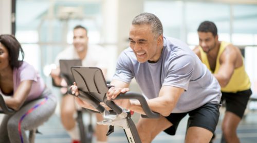 group of men on spinning bikes