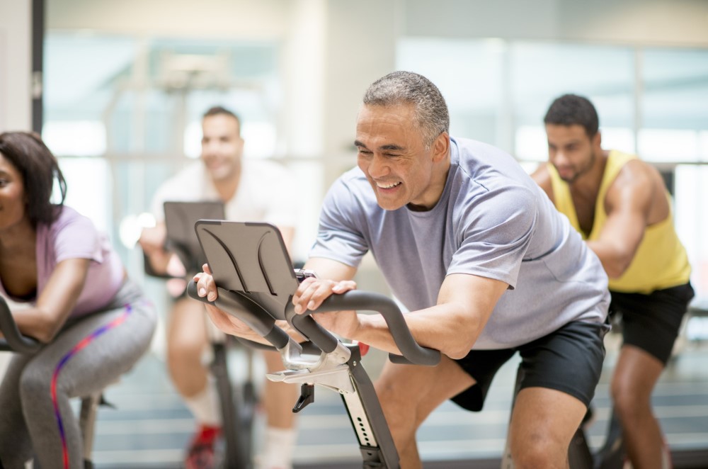 group of men on spinning bikes